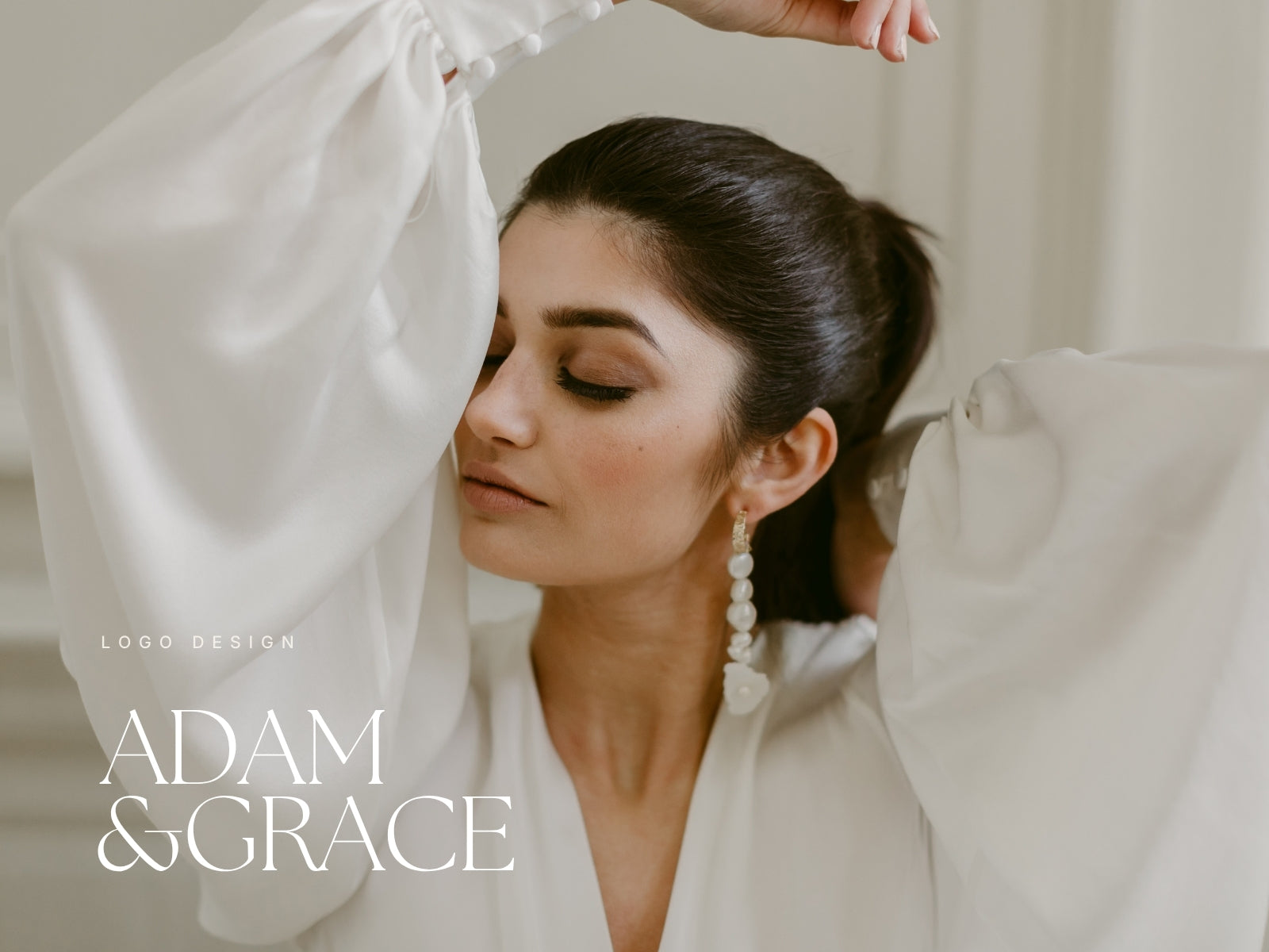 Bride wearing statement earrings with Adam and Grace branding