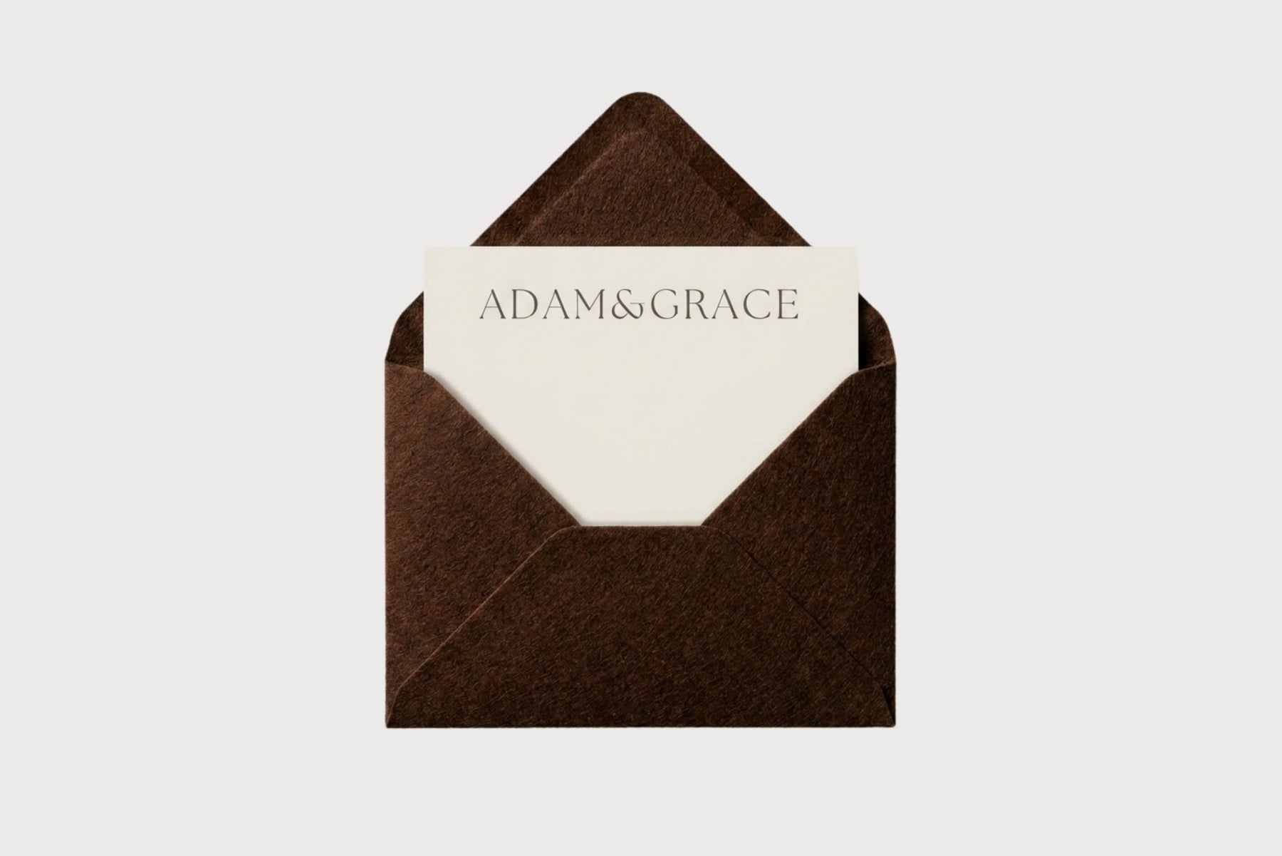 AG Business Cards in a brown envelope with the Adam and Grace logo