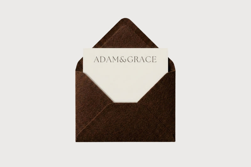 AG Business Cards in a brown envelope with the Adam and Grace logo
