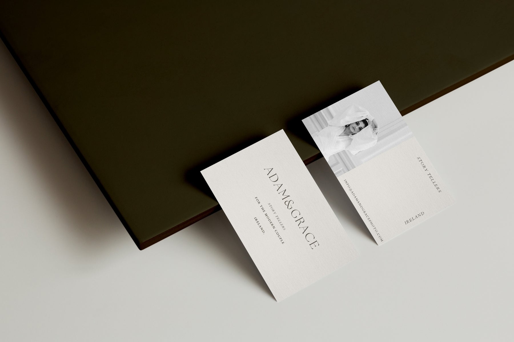 Minimal business card styled on a dark green background