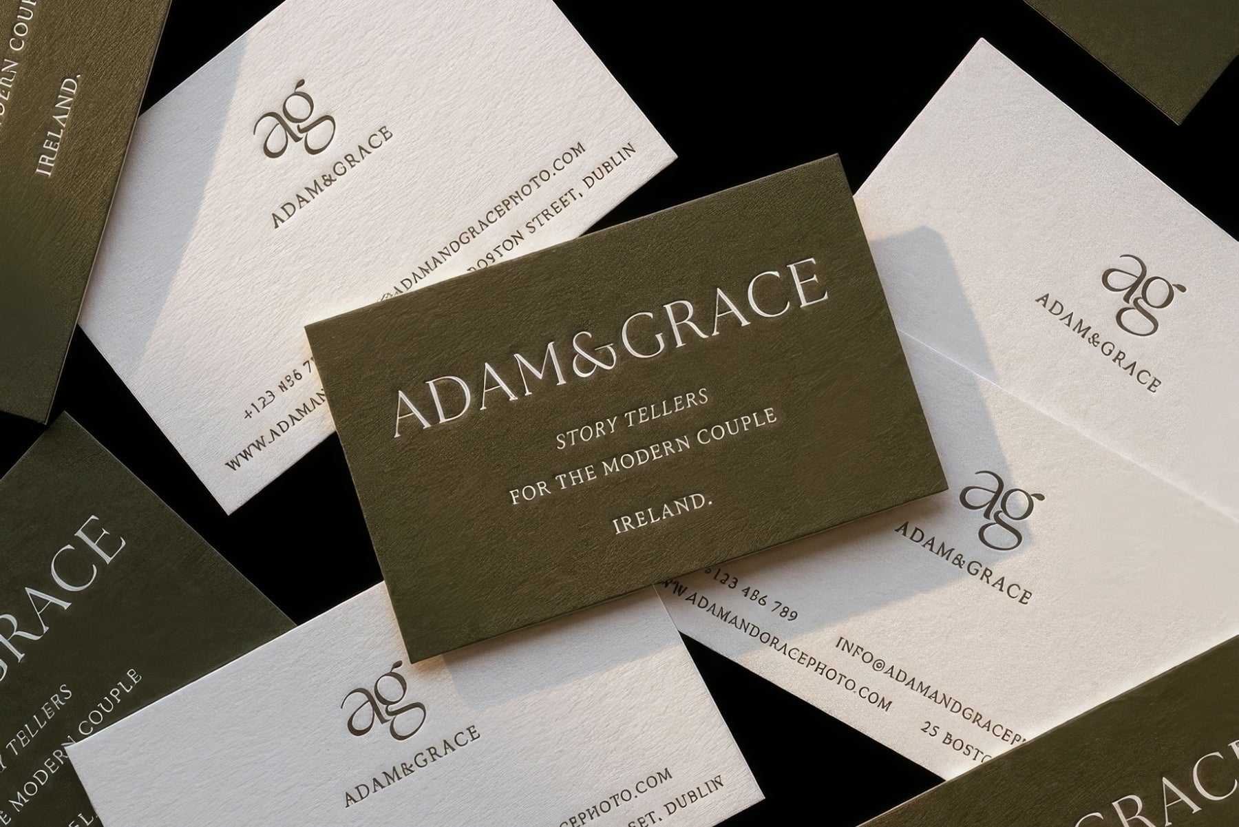 Adam and Grace business cards scattered, modern minimal design