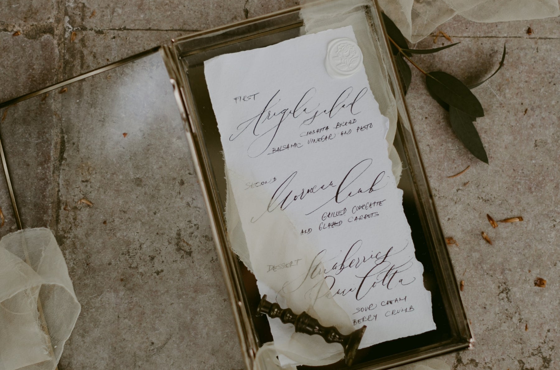 Wedding invitation suite styled on stone