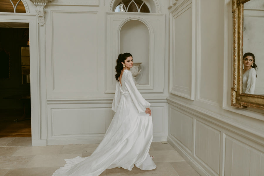 Bride in a white dress in an elegant hallway