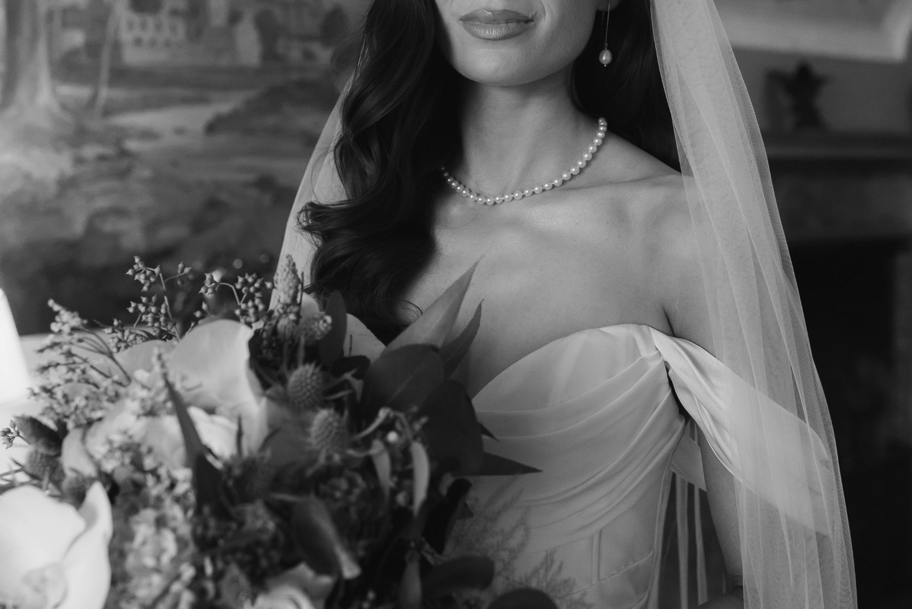 Black and white portrait of a bride in her veil