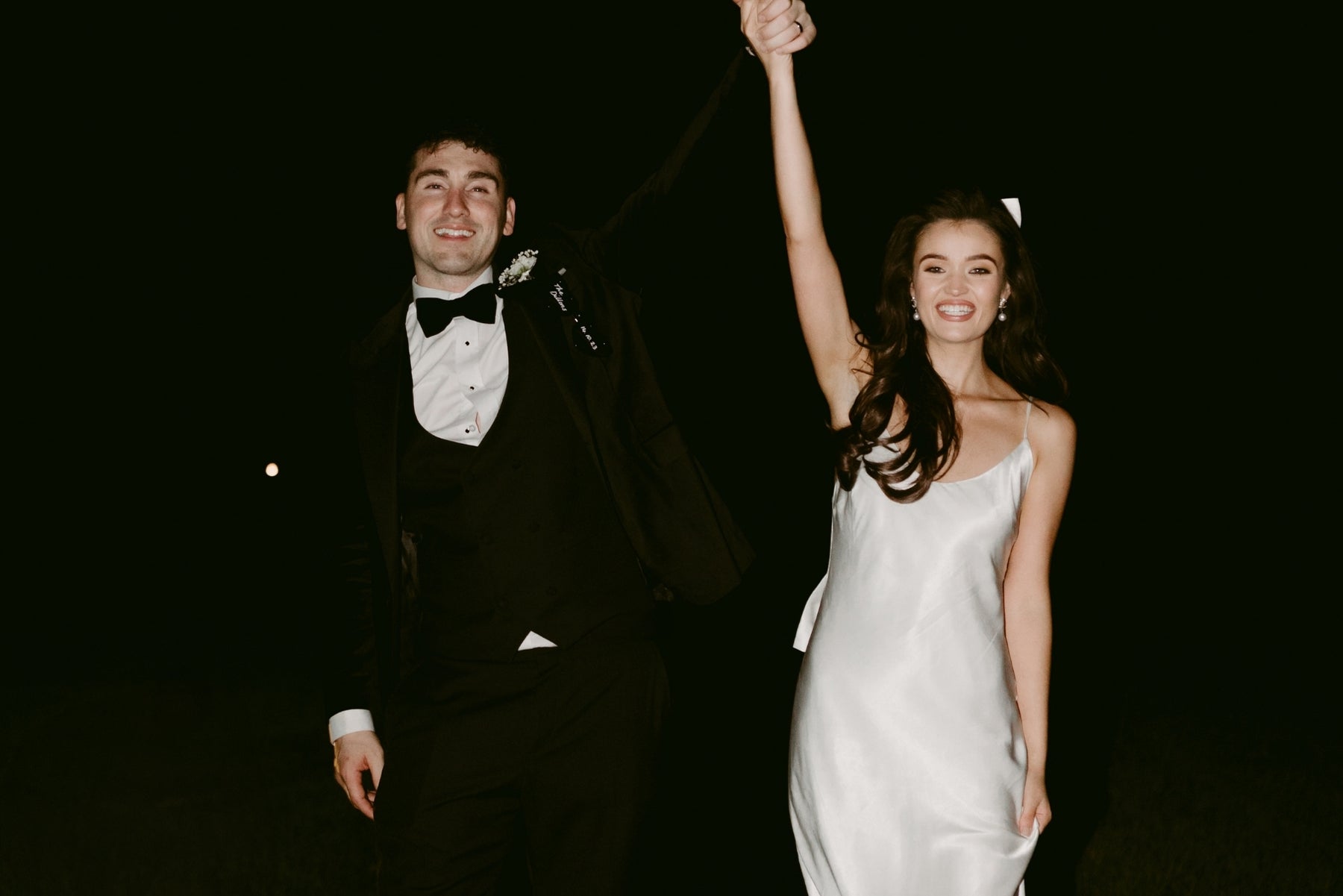 Bride and groom celebrating, natural wedding posing example