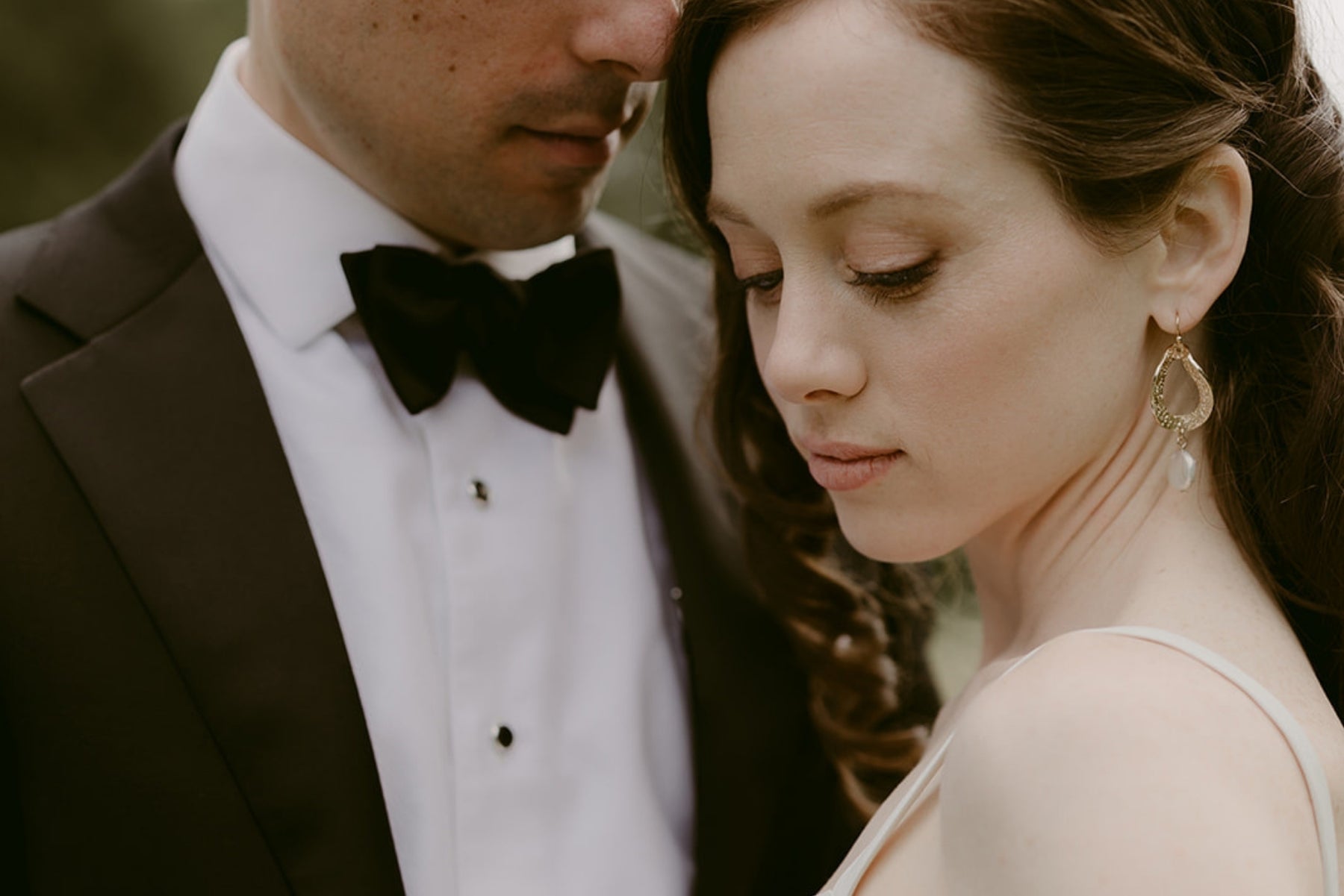 Close-up of a couple embracing, intimate wedding portrait